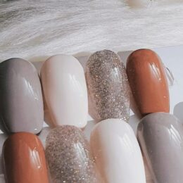Neutral nude press-on nail polish shades in cream, taupe and caramel