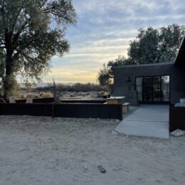 Beth Dutton outfits inspiration: my desert ranch house photo at dusk near Joshua Tree