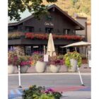 Casa Tua Aspen exterior with flowers and autumn trees