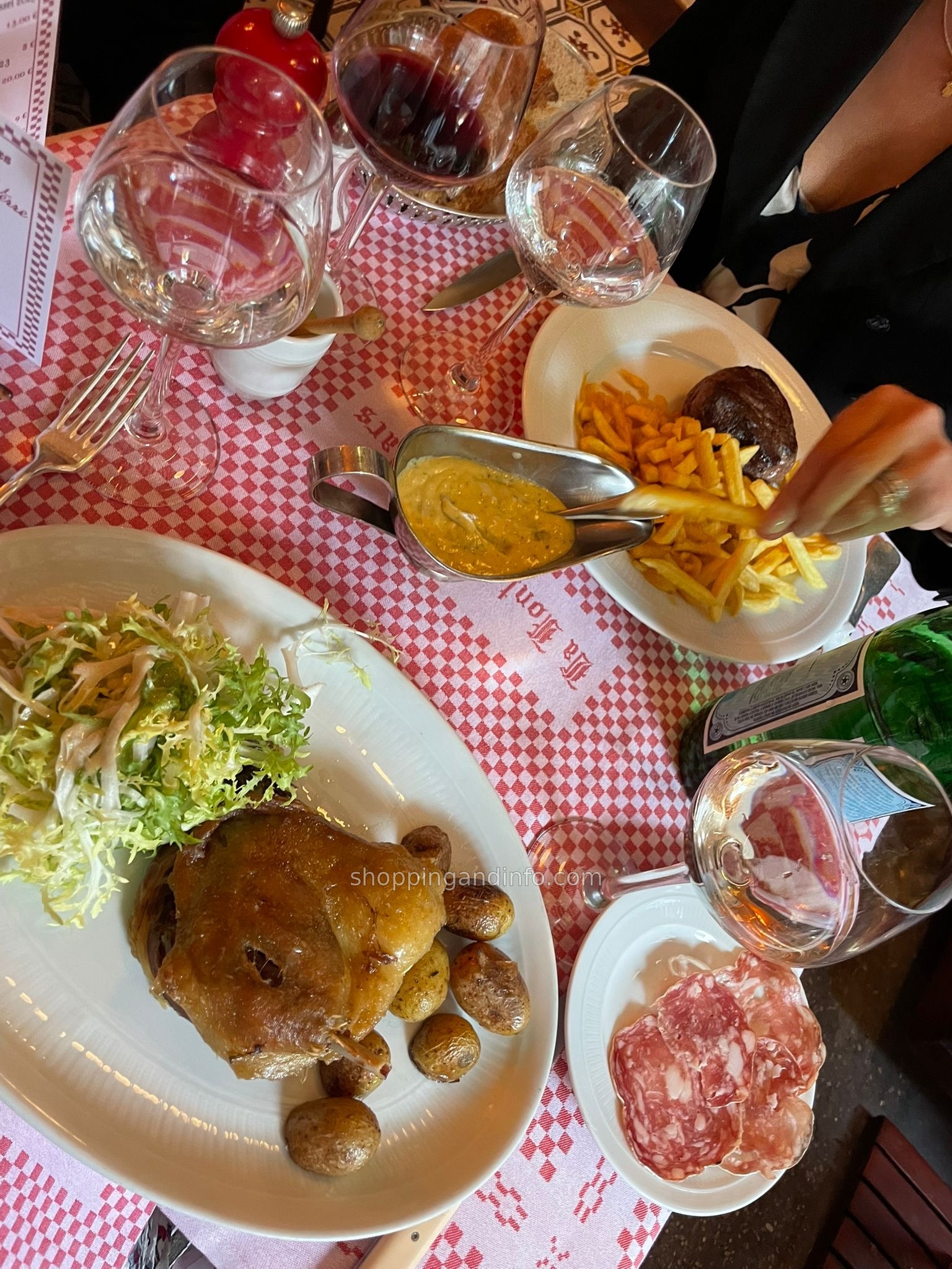Our Fontaine de Mars dinner: duck confit with potatoes and frisee, steak frites, saucisson and wine