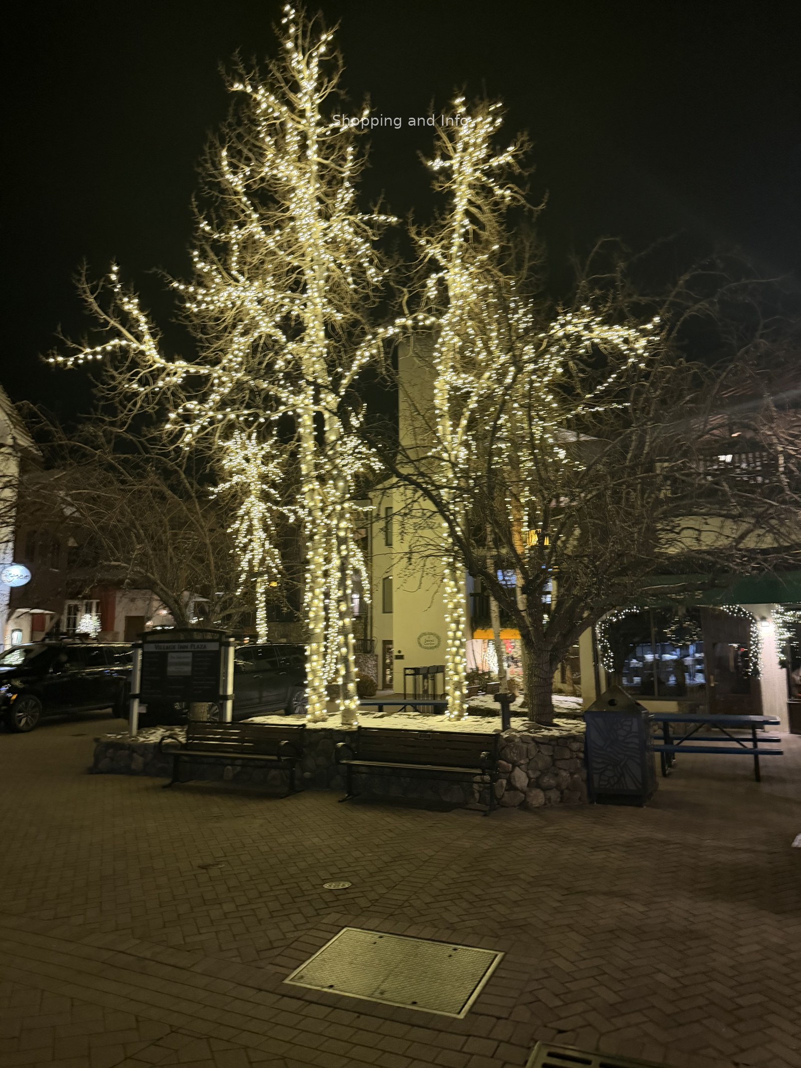 Best puffer coats and vests inspiration: winter lights in Vail village plaza