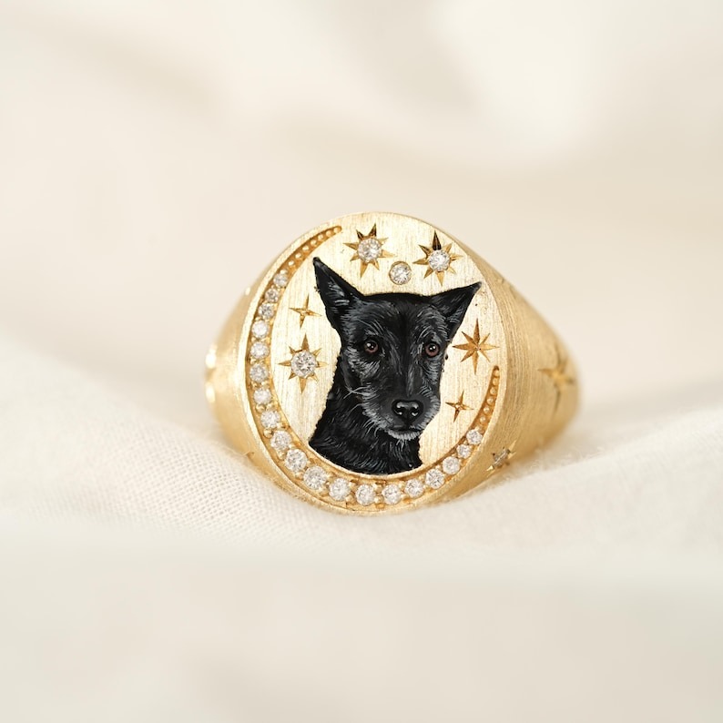 Custom enamel dog portrait ring with a black dog and star details