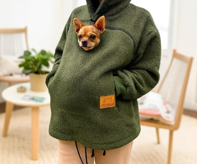 Olive boucle pocket hoodie shown carrying a small dog, cropped product detail
