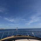Cabo boat bow and blue water - yacht club cocktail attire