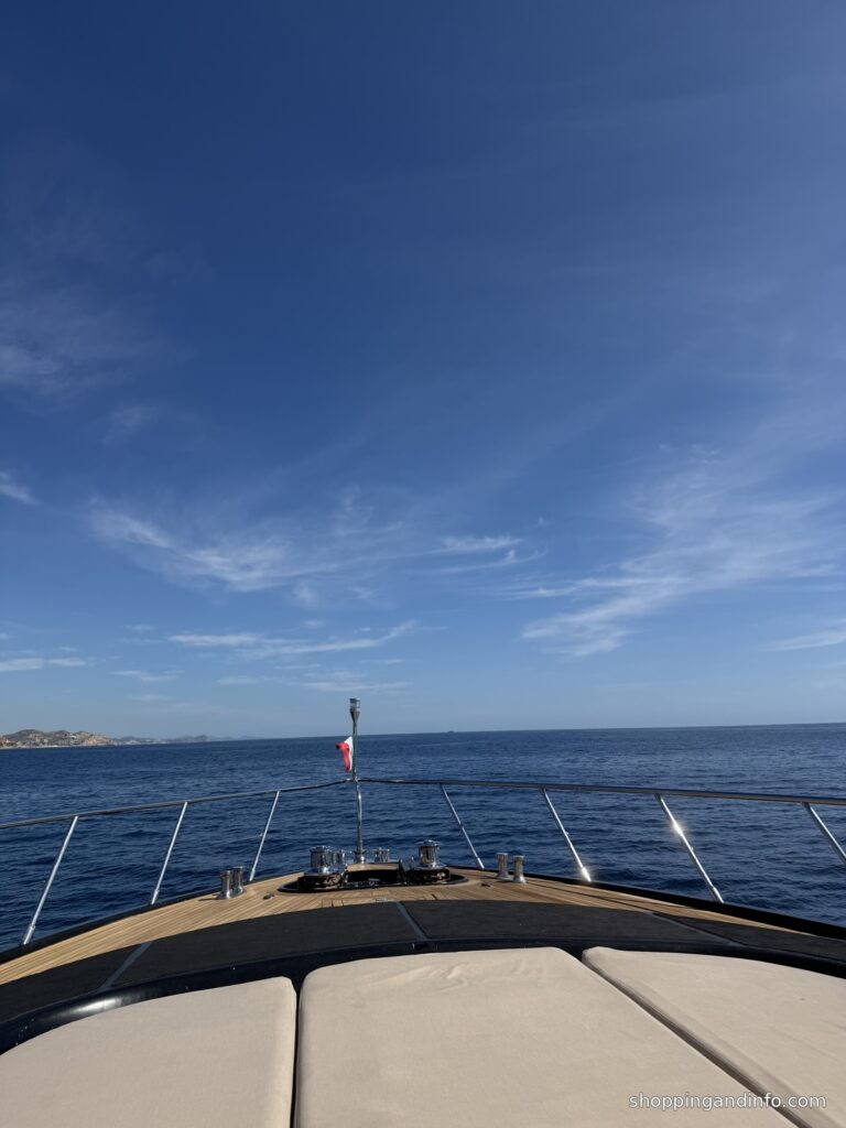 Cabo boat bow and blue water - yacht club cocktail attire