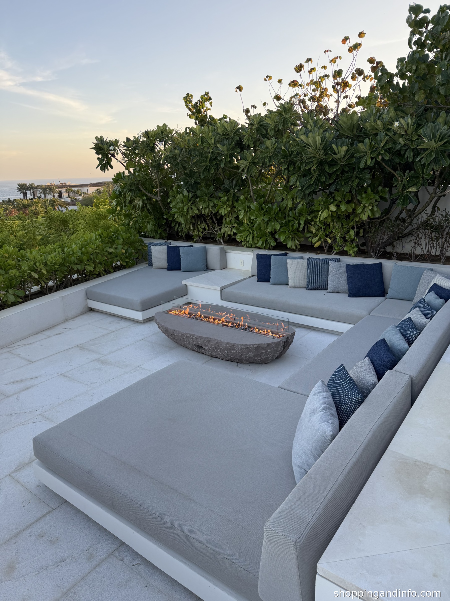 Cabo resort outfits inspiration - sunken outdoor lounge with a firepit, photographed by Shopping and Info
