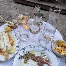 Date night outfits: dinner table for two with wine and candlelight at Le Procope in Paris