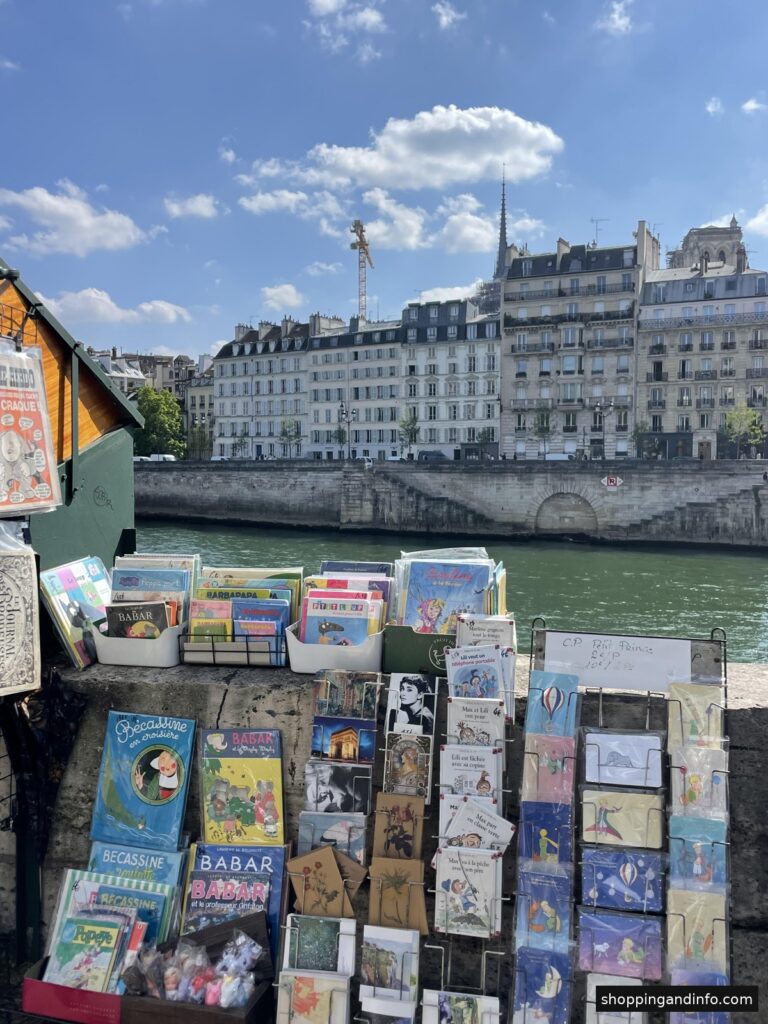 Low-profile sneakers with trousers inspiration: bookstalls beside the Seine in Paris, photographed by Shopping and Info
