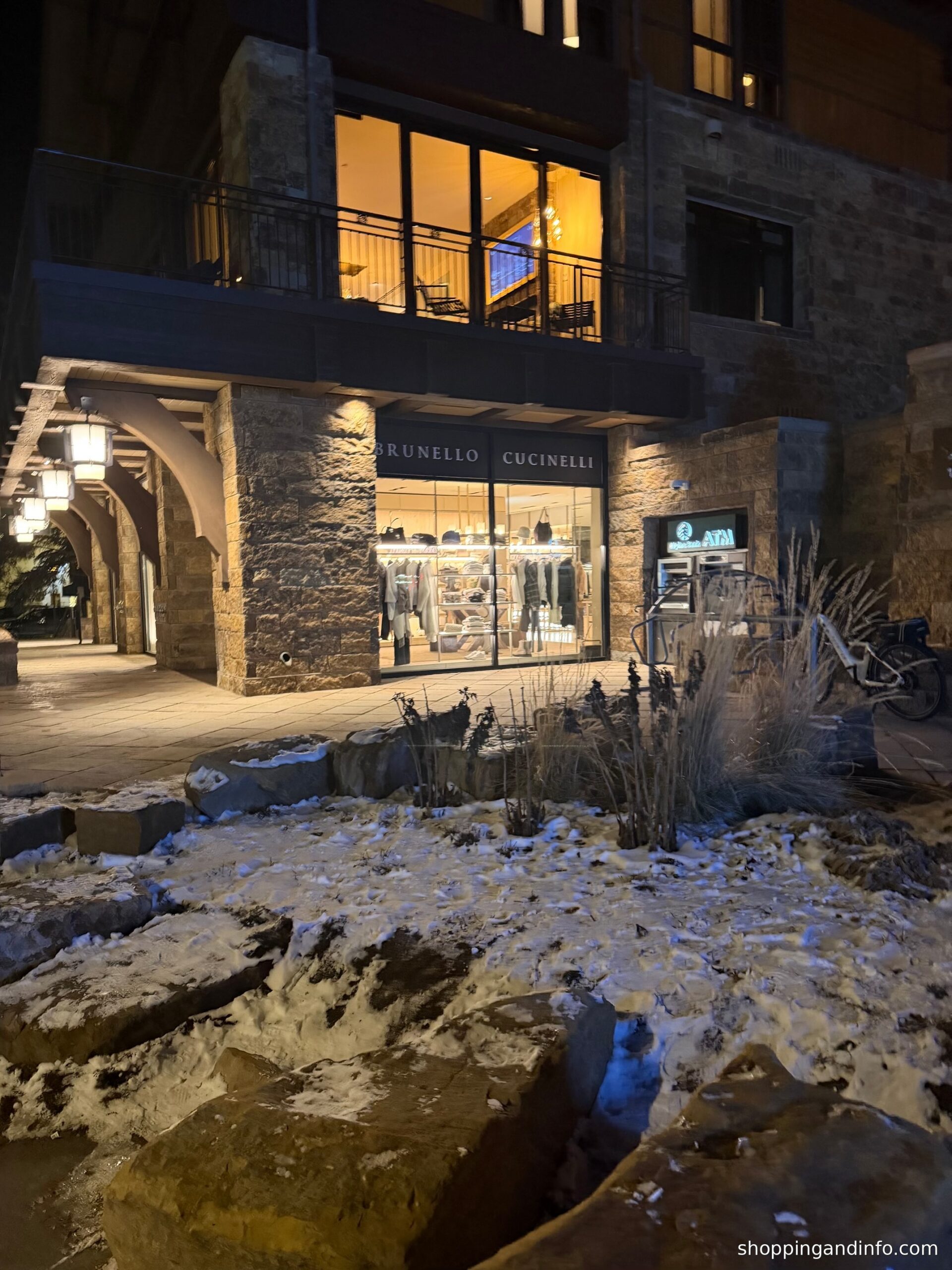 Vail Village: snow beside the village shops after dark
