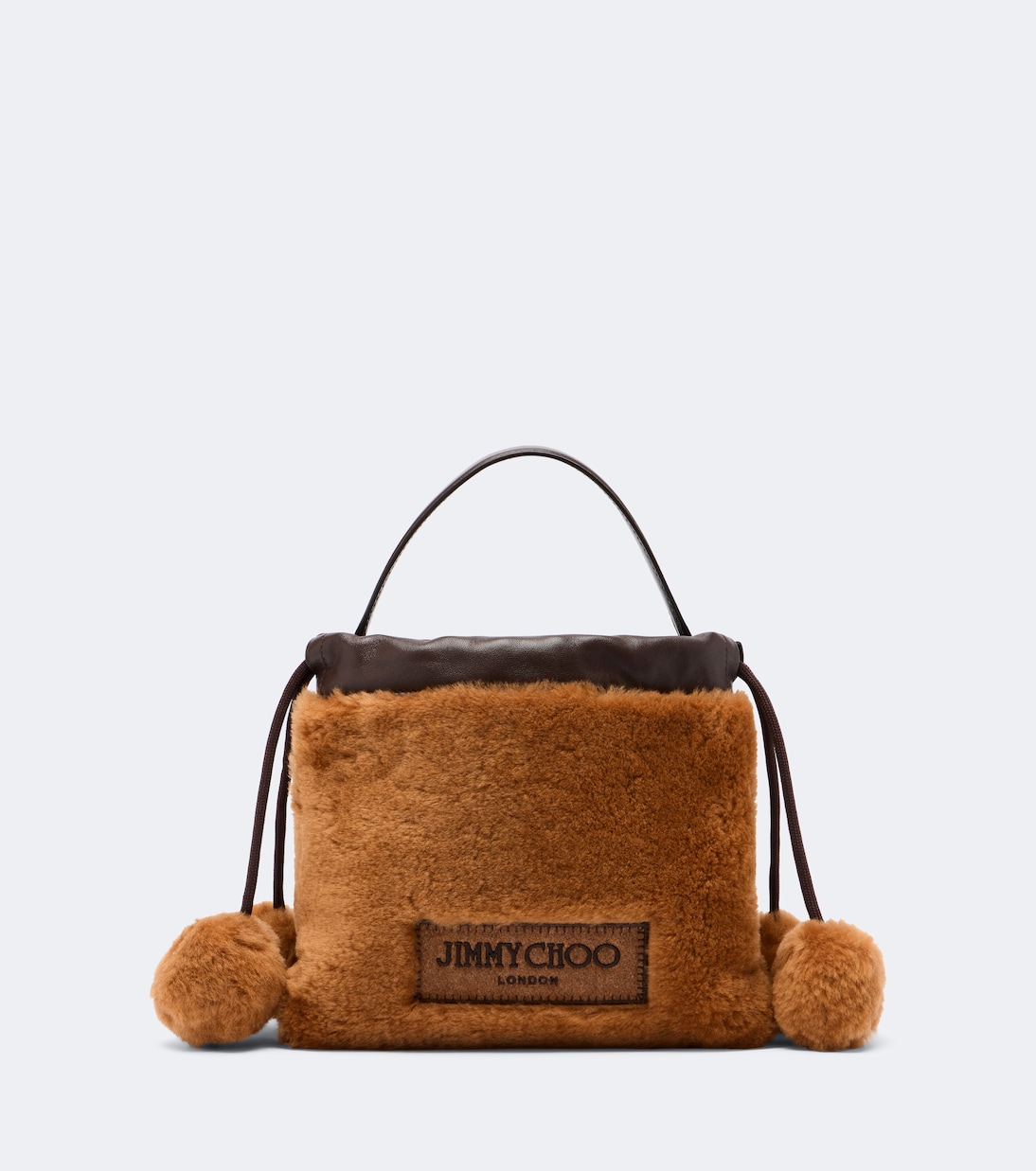 Drawstring Mini shearling top-handle bag in brown