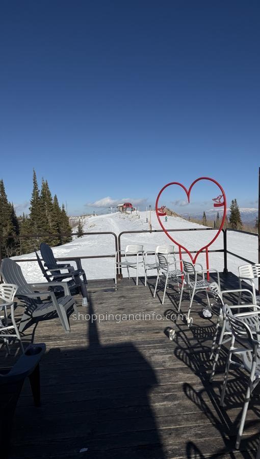 The Viking Yurt deck and red heart sculpture overlooking snowy Park City slopes