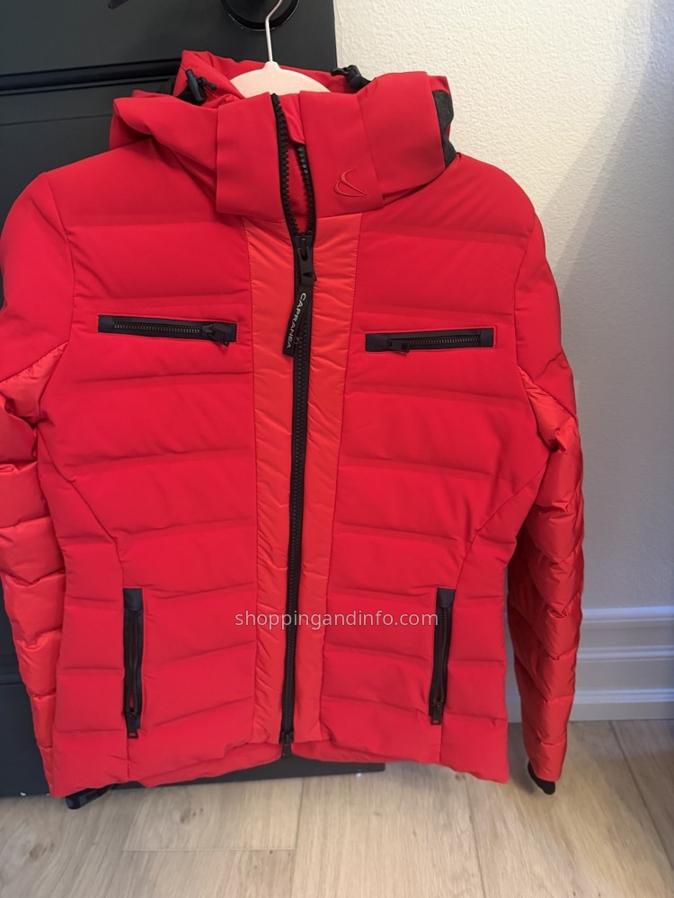 My red Capranea ski jacket with a stand collar and zip pockets