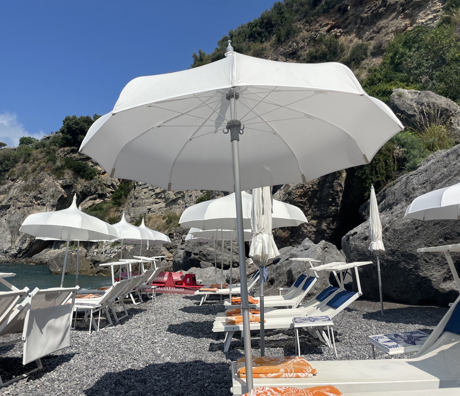 amalfi coast white beach umbrellas