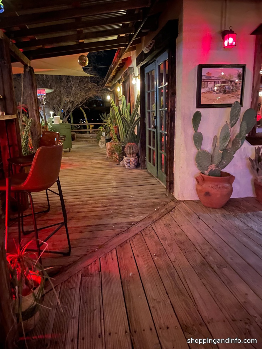 Joshua Tree dinner weekend: Kitchen in the Desert patio with a pink wall and wooden deck