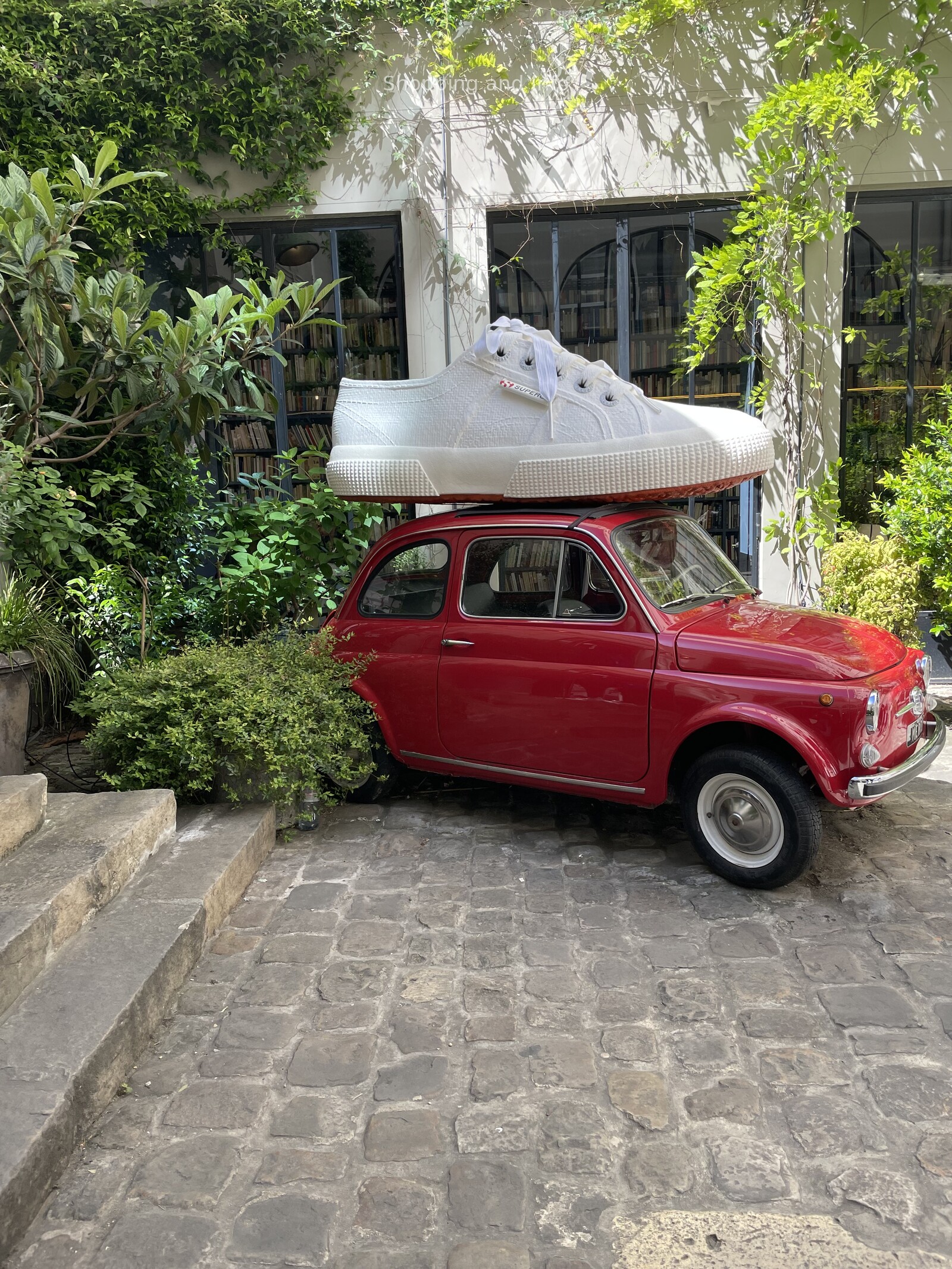 Designer crossbody bags: a cobblestone street in Paris on a walking day