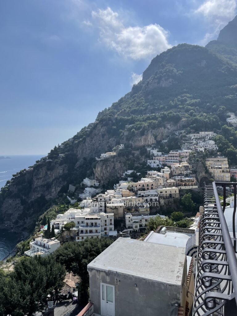 Positano coast viewed from a terrace with a railing