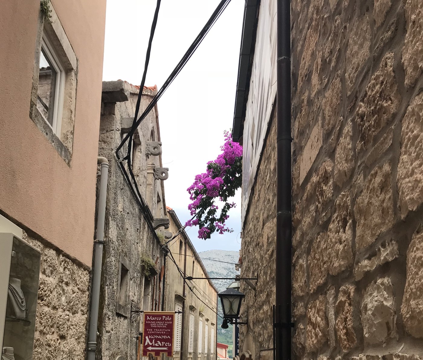 croatia stone alley bougainvillea