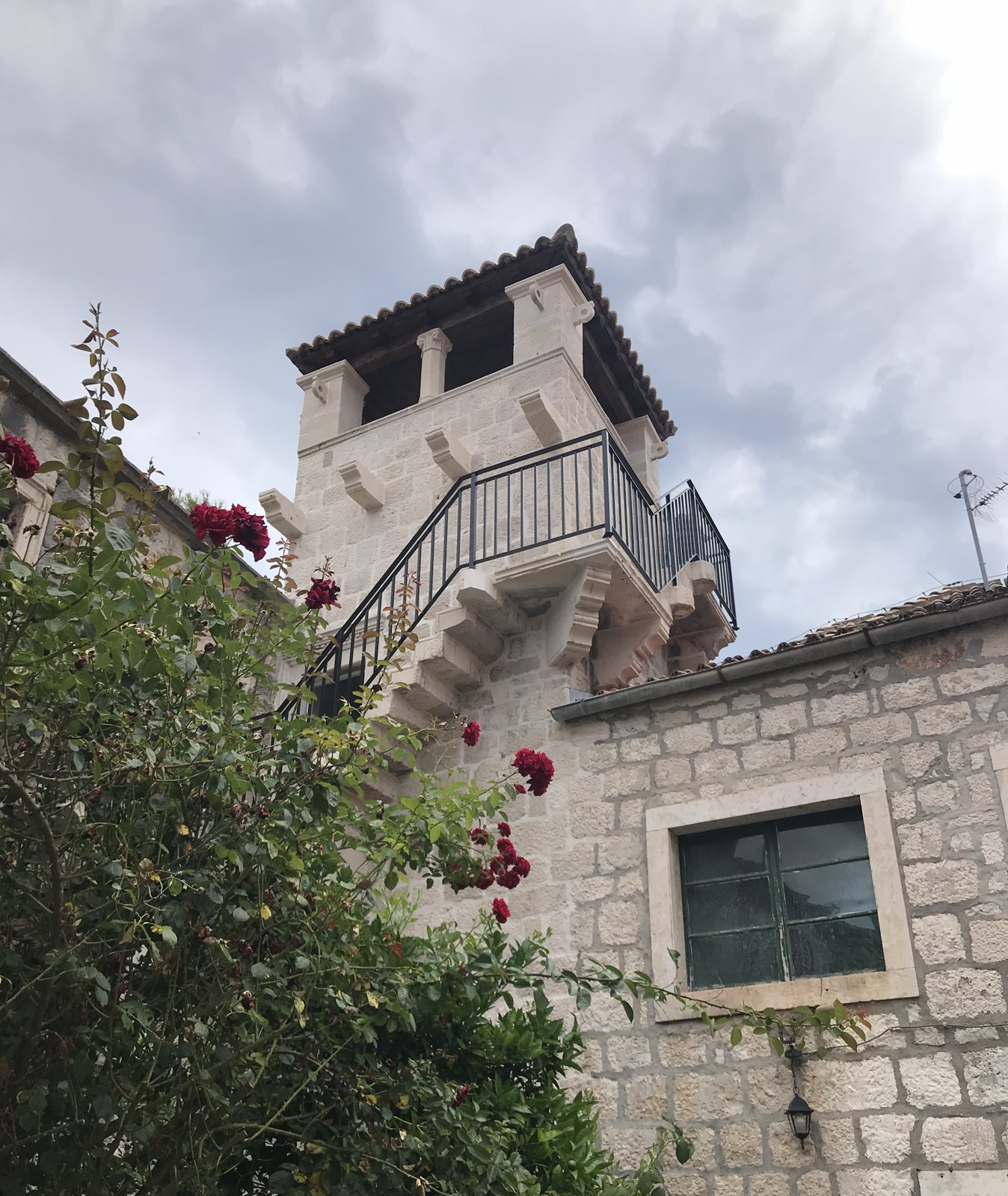 A stone tower with roses in Croatia