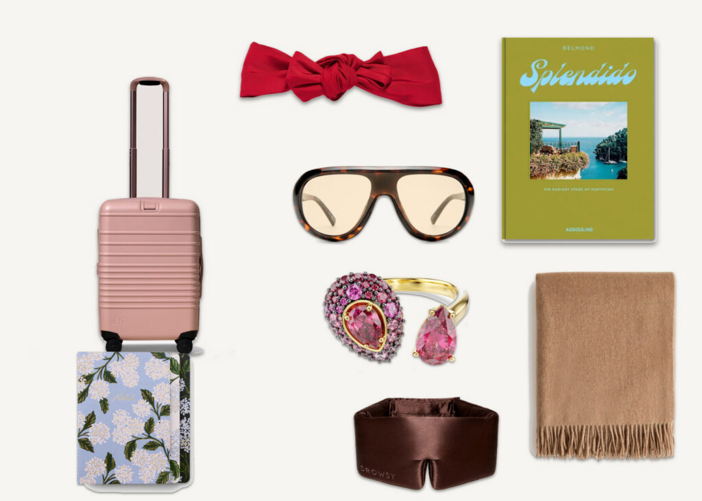 gifts for the woman who has everything - BEIS pink carry-on, Jennifer Behr red headwrap, Assouline Splendido book, Le Specs sunglasses, Swarovski pink ring, Quince cashmere throw, Rifle Paper Co floral notebook, Drowsy silk sleep mask flat lay collage