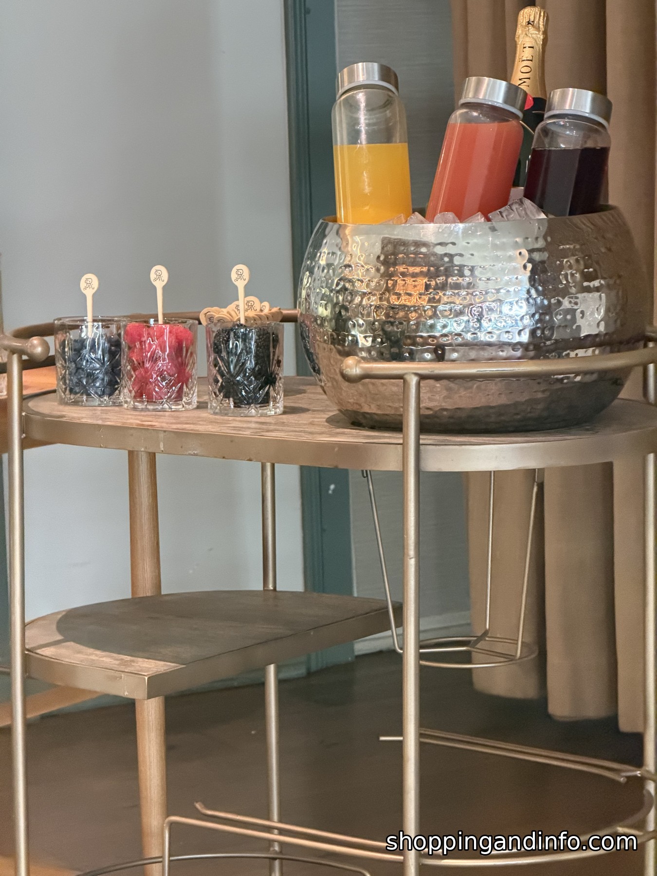 Brass bar cart with fresh juices and berry cups at the St. Regis Aspen breakfast Brass bar cart with fresh juices and berry cups at the St. Regis Aspen breakfast
