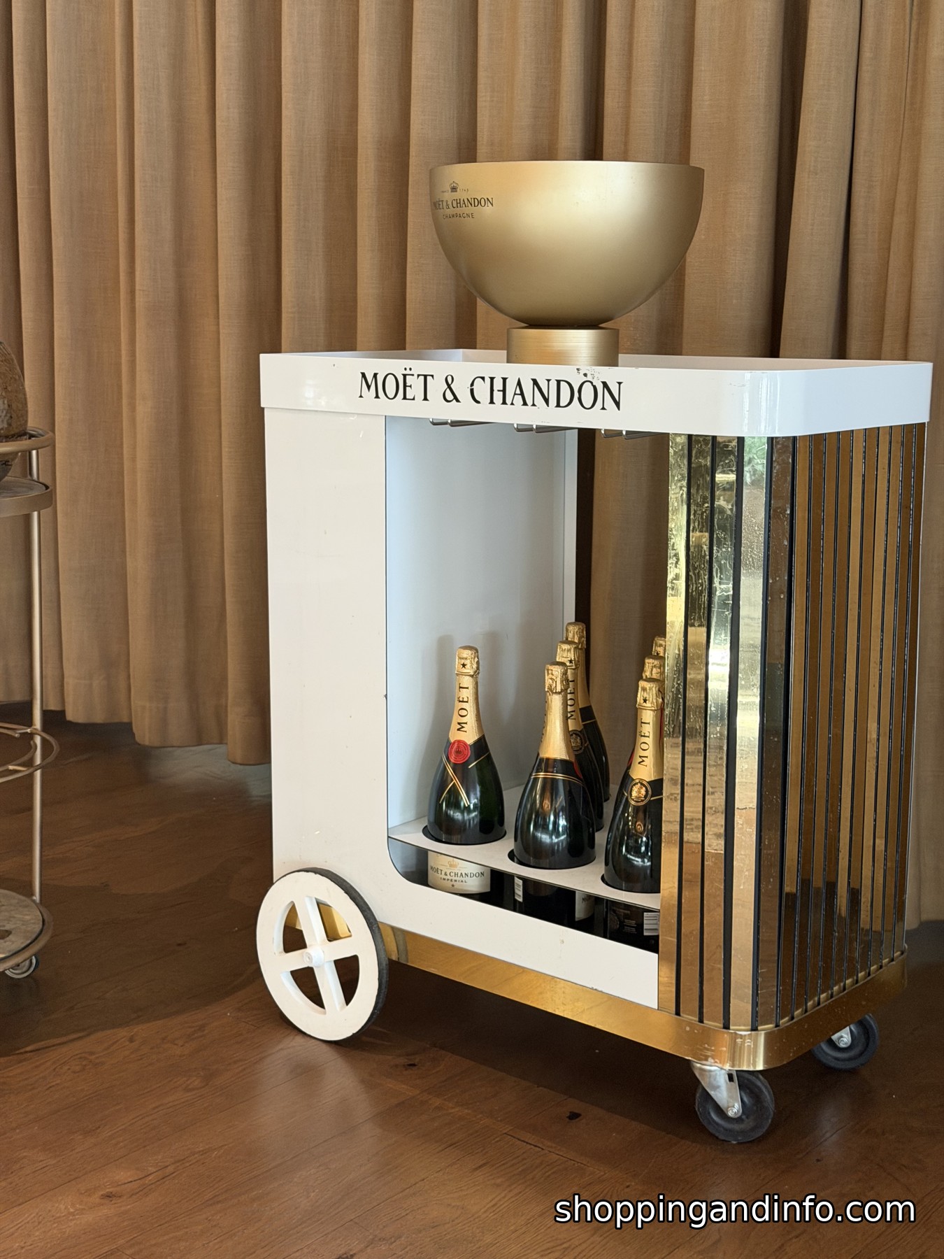 Moët & Chandon champagne bar cart with a gold ice bucket at the St. Regis Aspen breakfast Moët & Chandon champagne bar cart with a gold ice bucket at the St. Regis Aspen breakfast